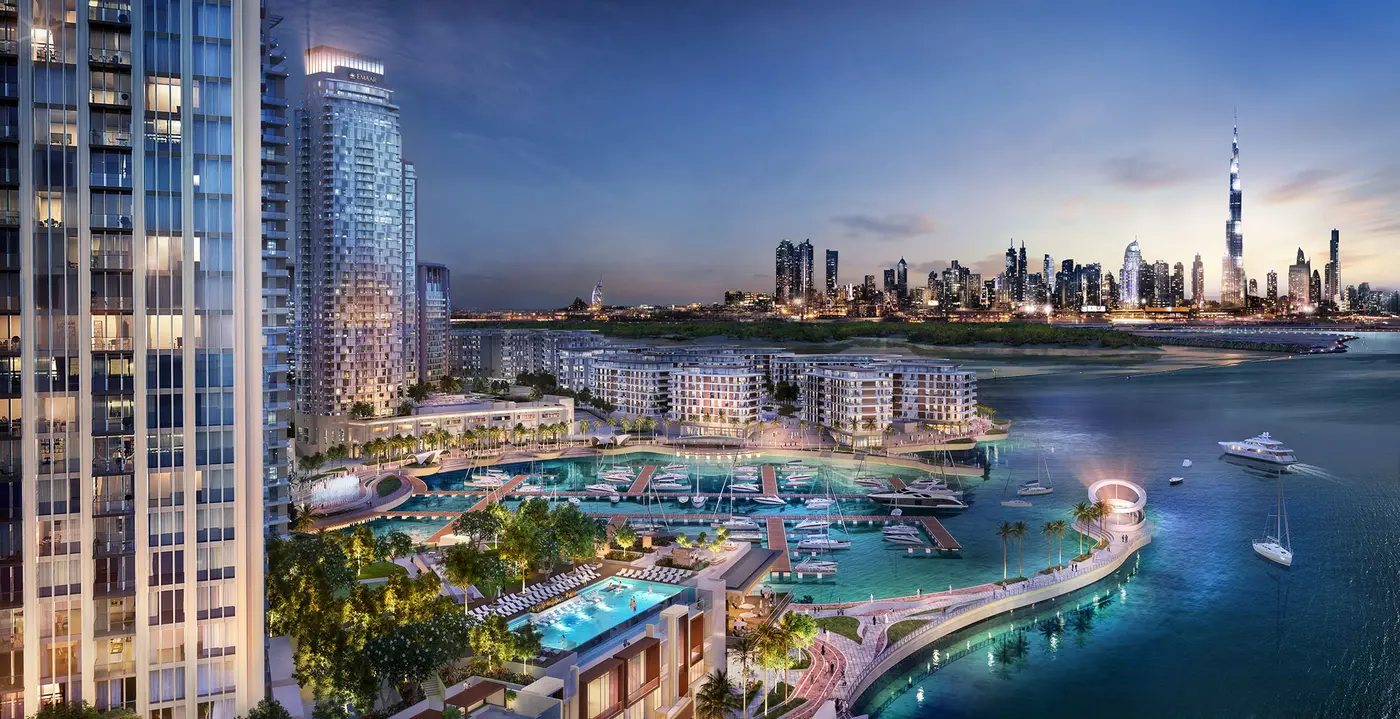 Valia by Emaar rising above Creek Marina at Dubai Creek Harbour at dusk